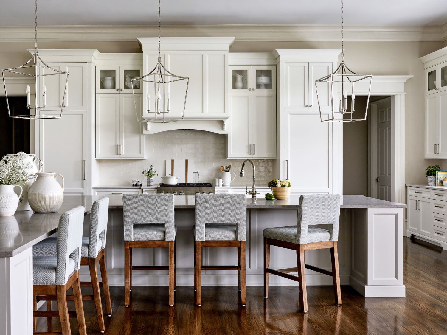 Cream Kitchen Cabinets Paired with Warm Wood Stools at a Large Island in a DC Kitchen Remodel