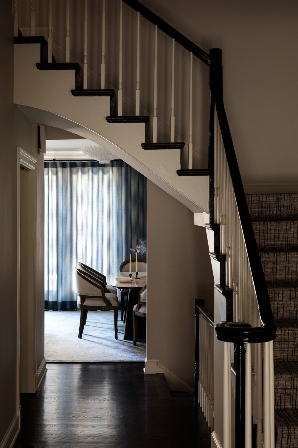 Corner Staircase with View Into Dining Room of Remodeled Home in DC